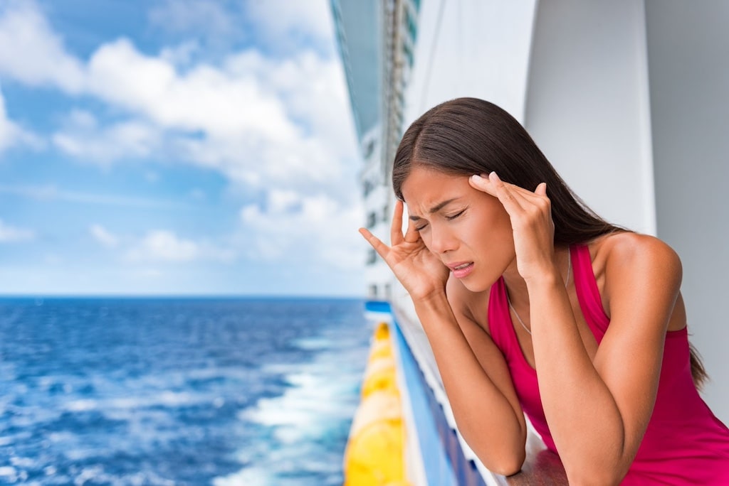 Woman With A Headache Standing By Ship Railing