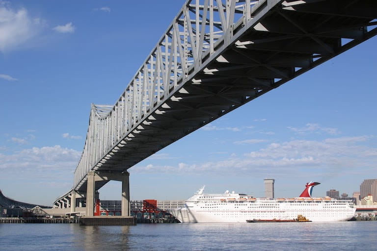 Cruise Ship Sailing Under Bridge